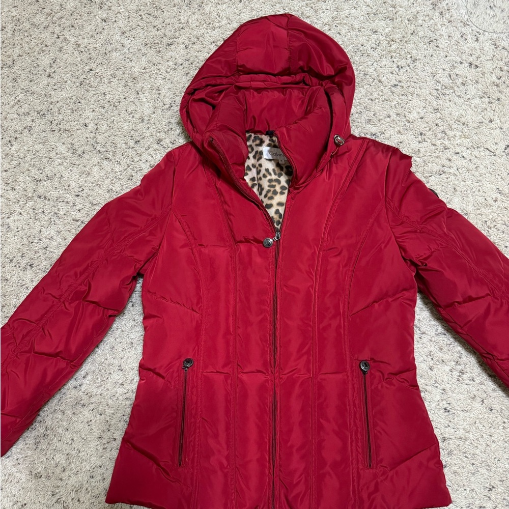 Red down Calvin Klein jacket. Size M. 25” length.